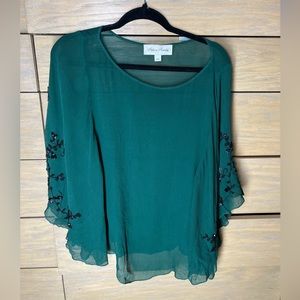 Pretty green blouse with black sequin details on sleeves